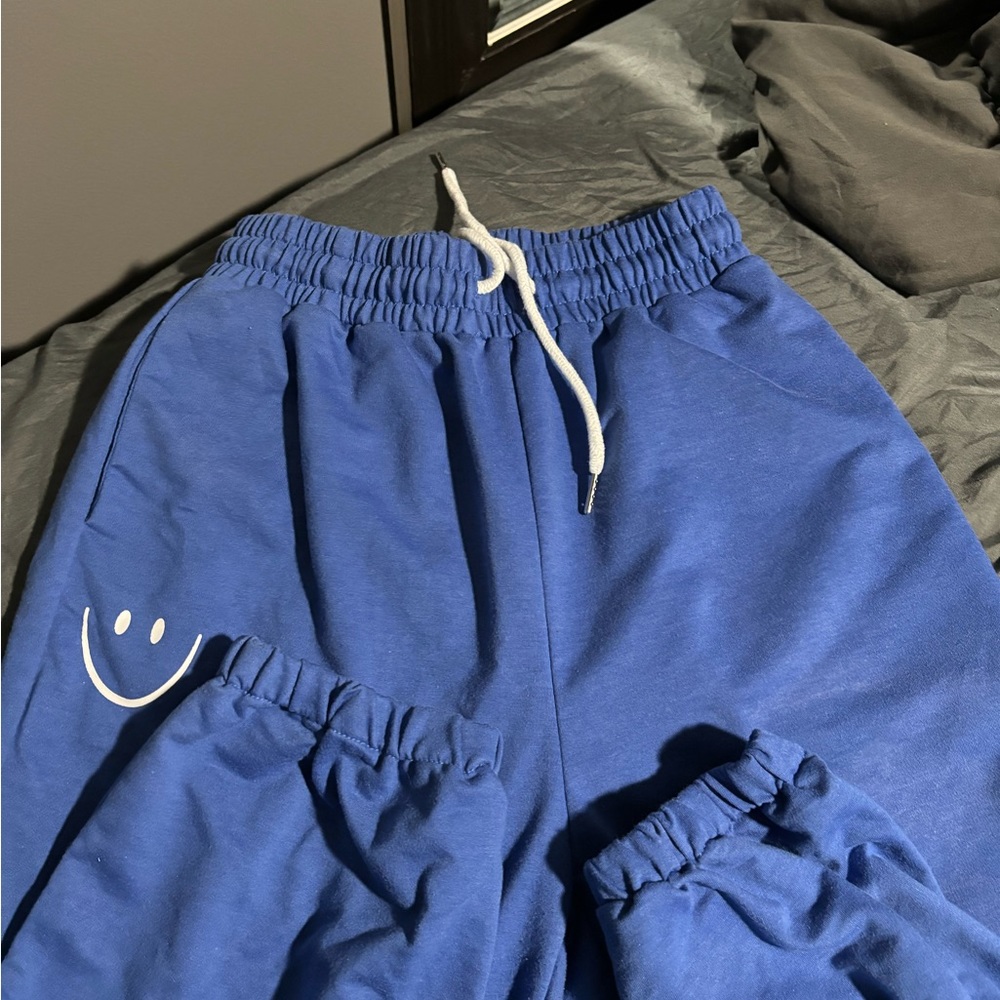 blue smiley face sweats